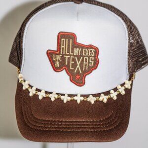 Brown and white "All my exes live in Texas" hat with hat jewelry
